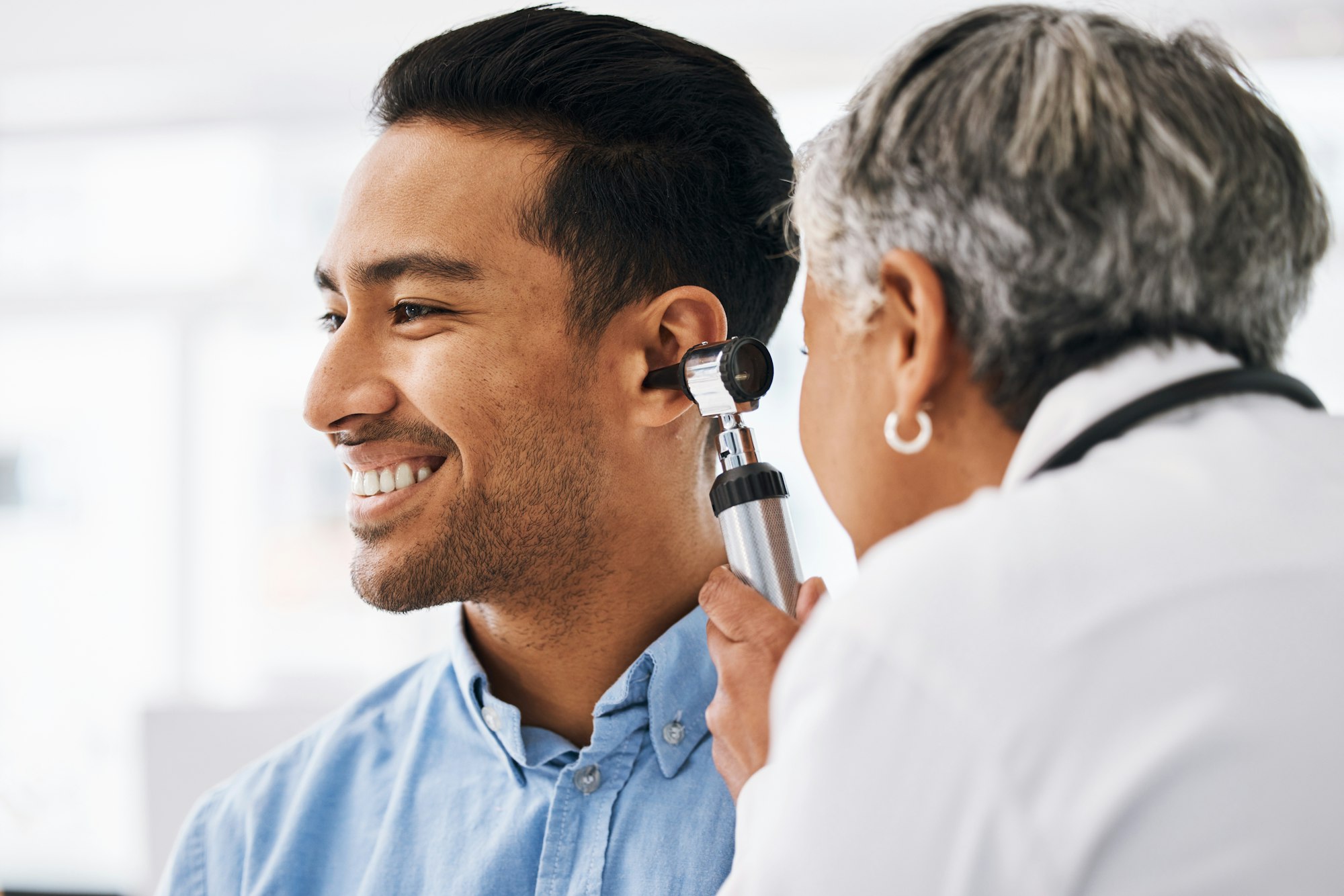 Doctor check patient ear, healthcare and medical consultation at hospital with otolaryngology speci